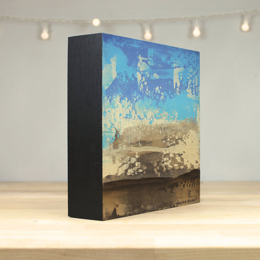 Rectangular box with abstract design on a wooden surface