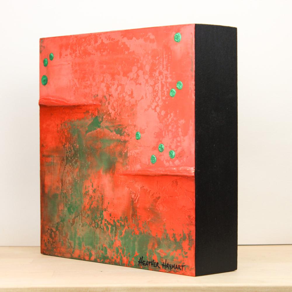 second side view of red and green abstract artwork