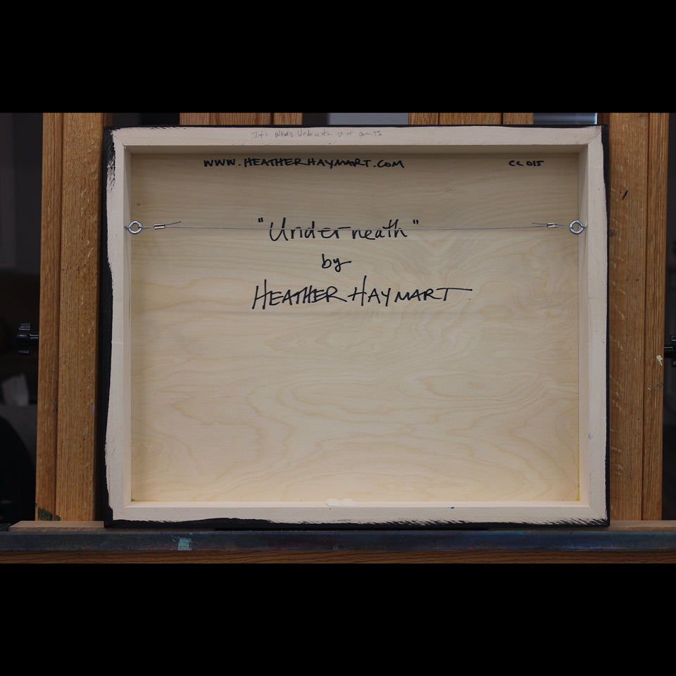 Back view of framed artwork with a wire, signed by Heather Haymart.