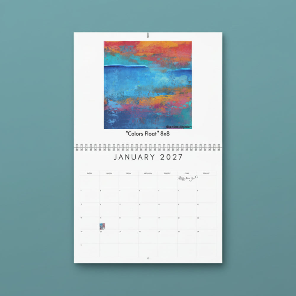 A spiral-bound January 2027 wall calendar page with a colorful abstract painting at the top labeled "Colors Float 8x8" and a white calendar grid below.