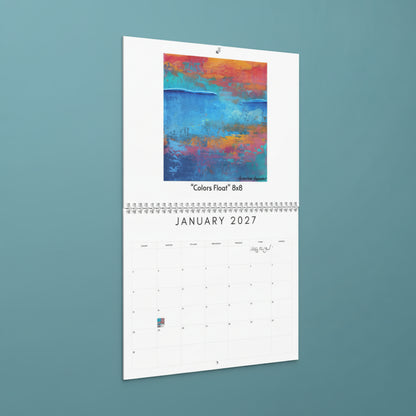 A single-page hanging calendar or art print showing an abstract painting titled "Colors Float" at the top and a January 2027 grid below on a white page.