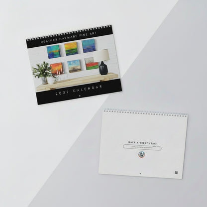 A styled flat-lay of a 2027 spiral-bound calendar from Heather Haymart Fine Art, shown alongside its blank cover page and on a split white and light gray background.