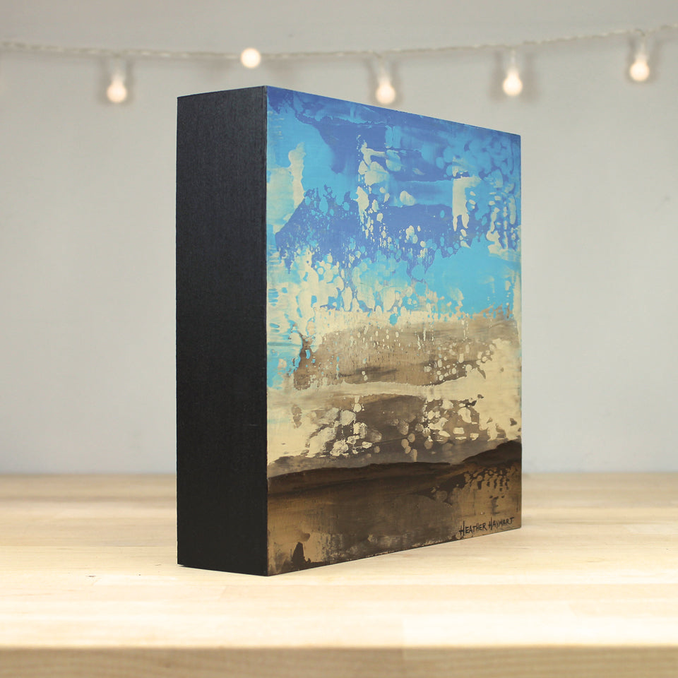 Rectangular box with abstract design on a wooden surface