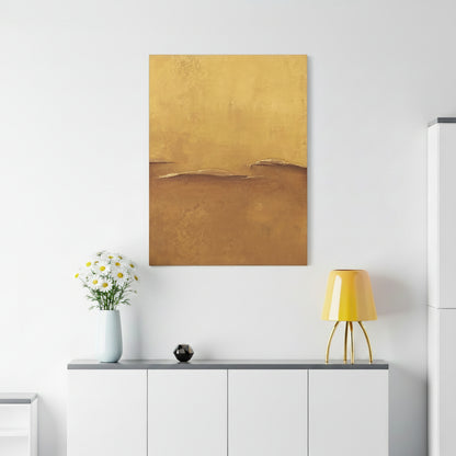 Abstract canvas art print gold painting on a white wall above a white cabinet with decorative items.