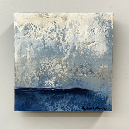 Abstract textured art with blue and white tones on a gray background