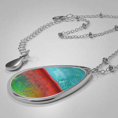 Colorful pendant with a silver chain on a light gray background
