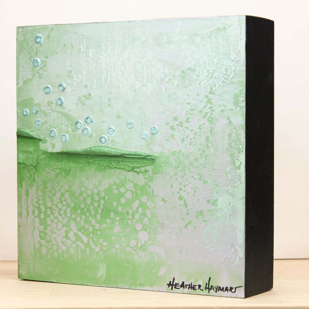 side view of painting with shades of green, gray and duck egg blue