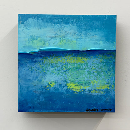 Abstract painting with ocean blue and green hues on a light gray background