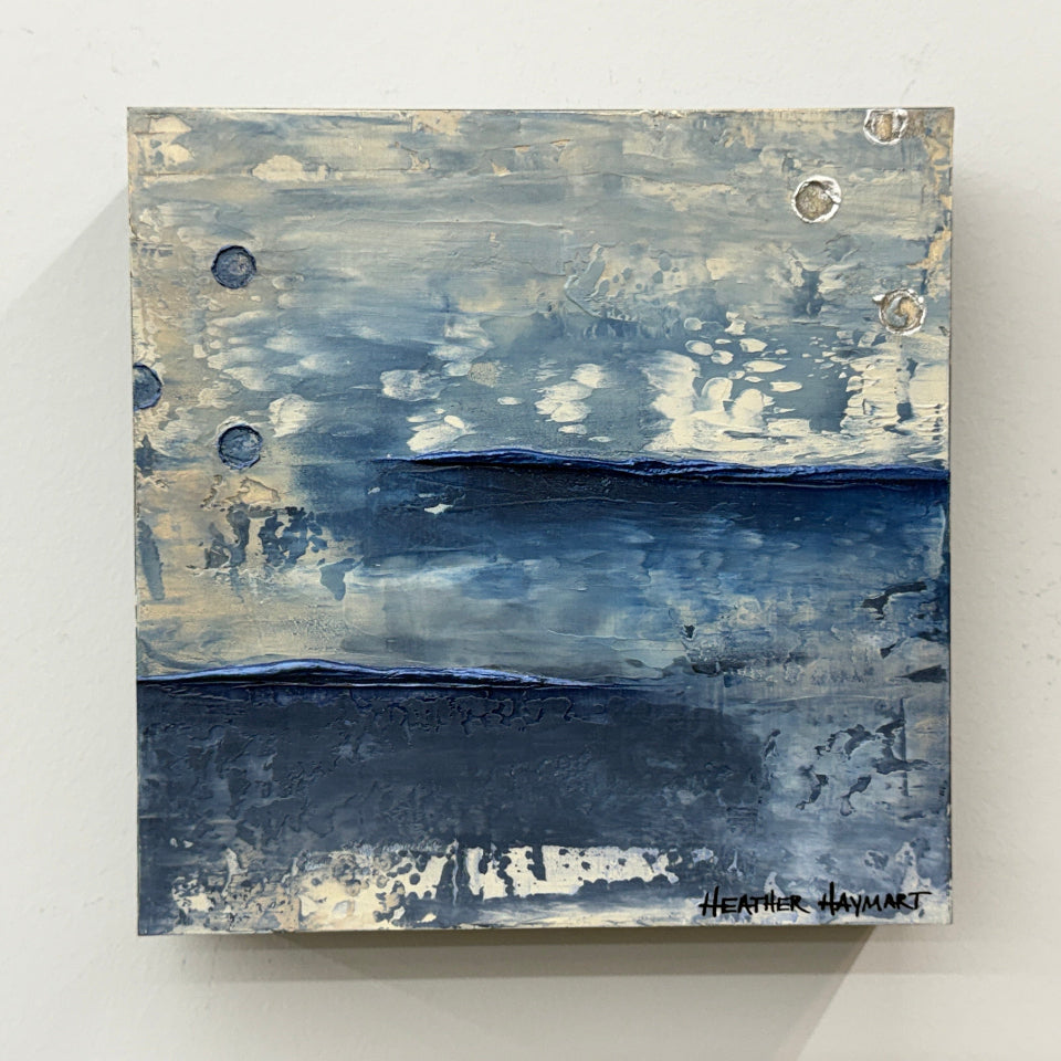Abstract painting with horizontal brushstrokes in blue, gray, and white on a light gray background with metallic does .