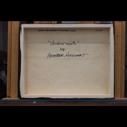Back view of framed artwork with a wire, signed by Heather Haymart.